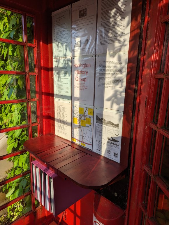 A telephone box converted to house historical information about the village